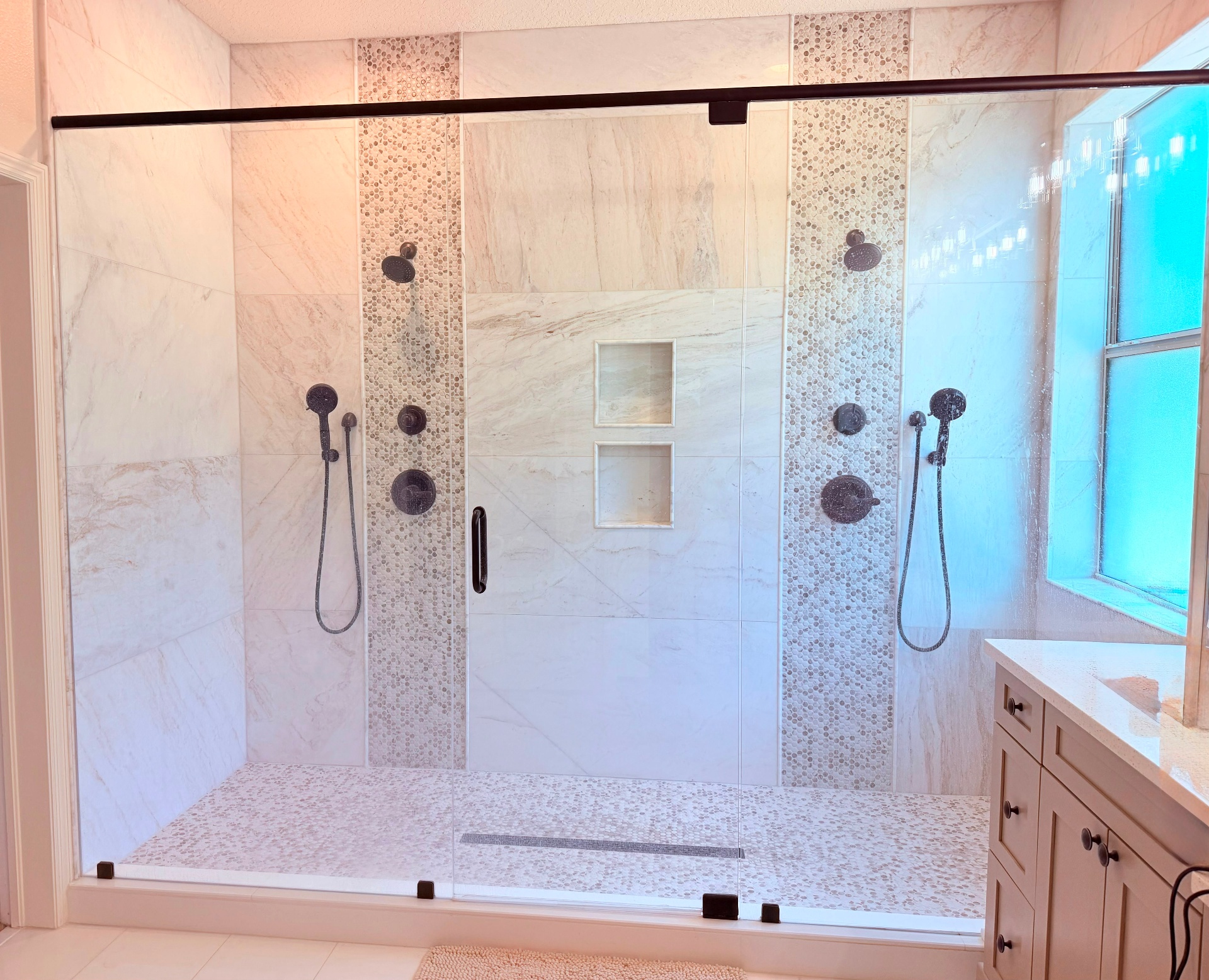 Modern bathroom remodel with marble-tile walk-in shower, Land O’Lakes, FL