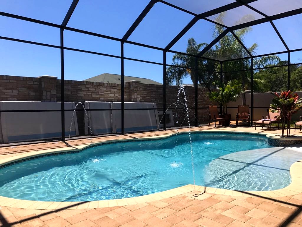 Custom aluminum pool cage with fountain jets — Land O’Lakes, Florida