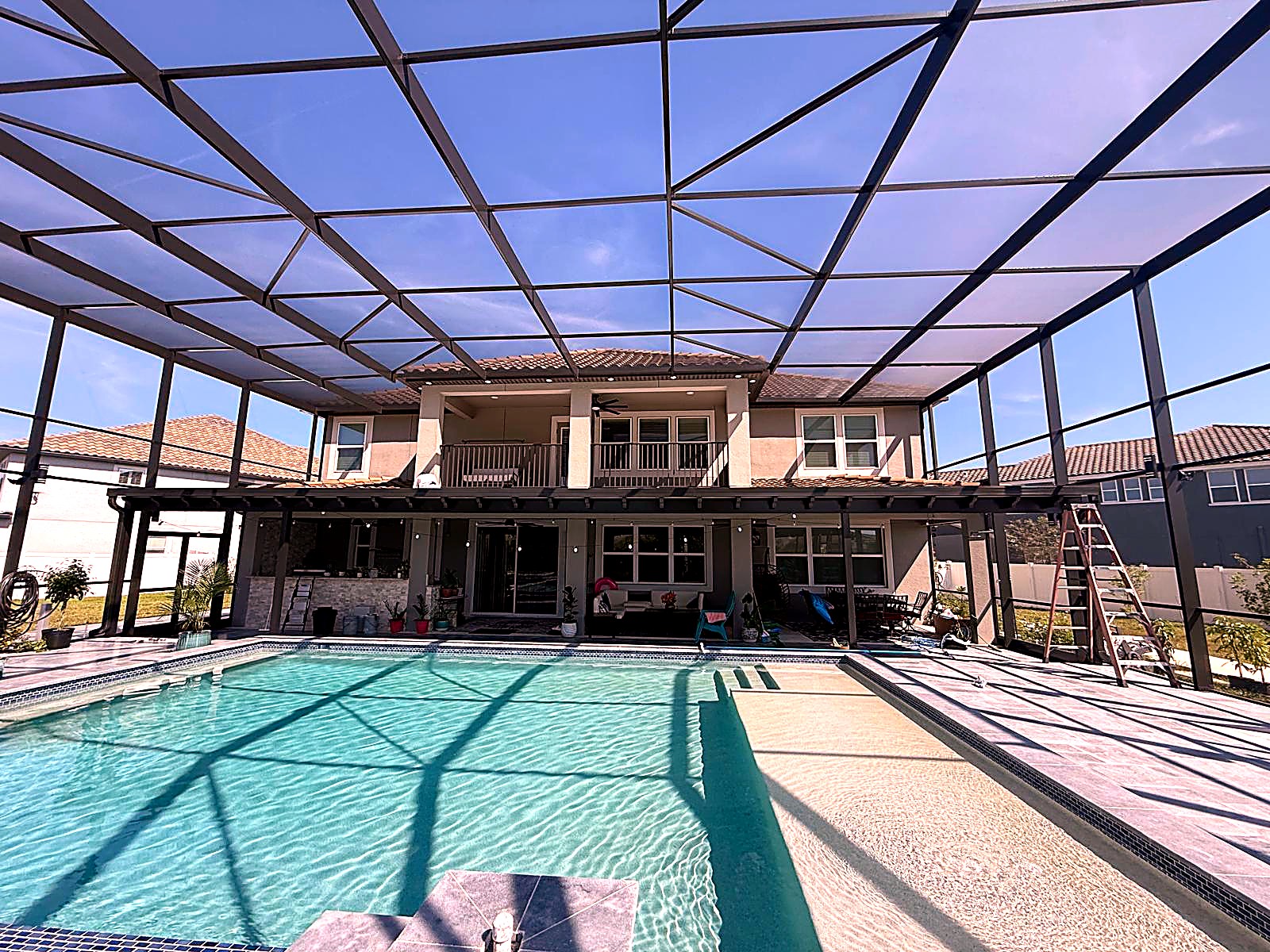 New pool cage over pool with lanai seating — Land O’Lakes, FL